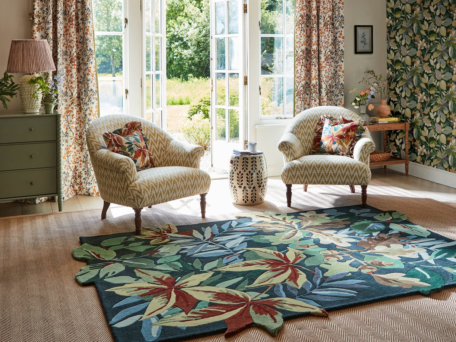 A forest green heritage-design rug styled in a room setting