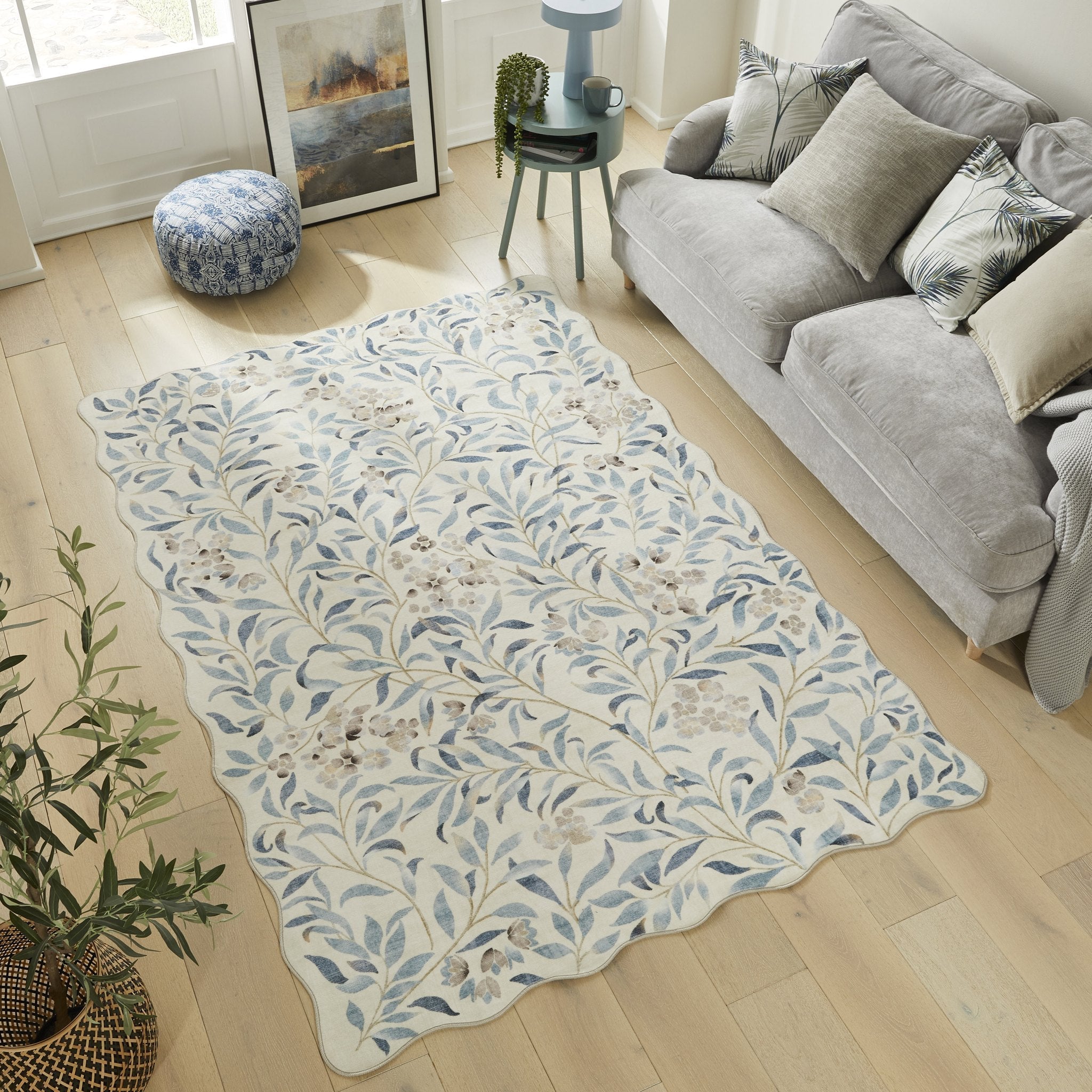 An ivory and blue floral rug in a contemporary living room