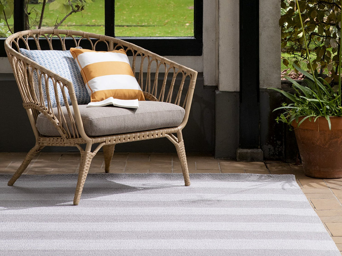 Laura Ashley Lille Dove Grey outdoor rug on a terrace