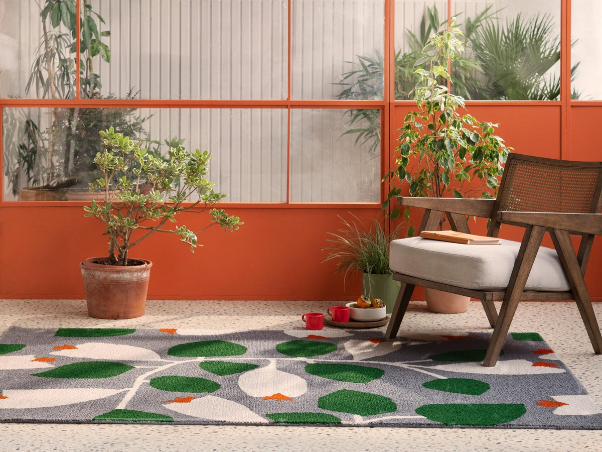 Scion Rosehip Blue outdoor rug on a terrace