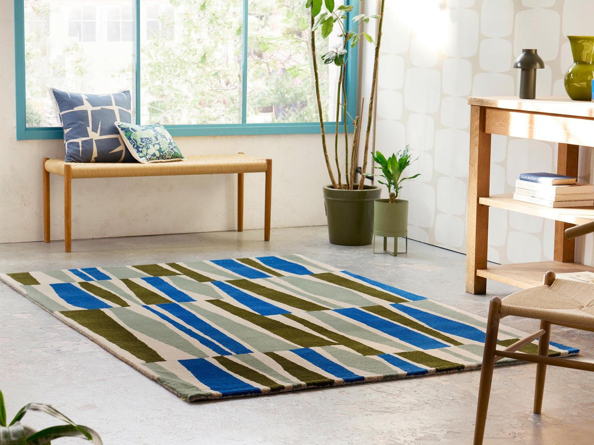 Scion Saku Olive rug styled in a room setting