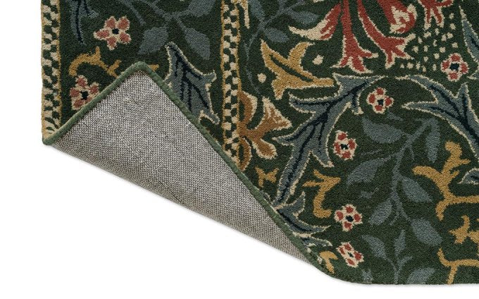 Morris & Co Walthamstow Forest Teal rug corner turned to show the backing