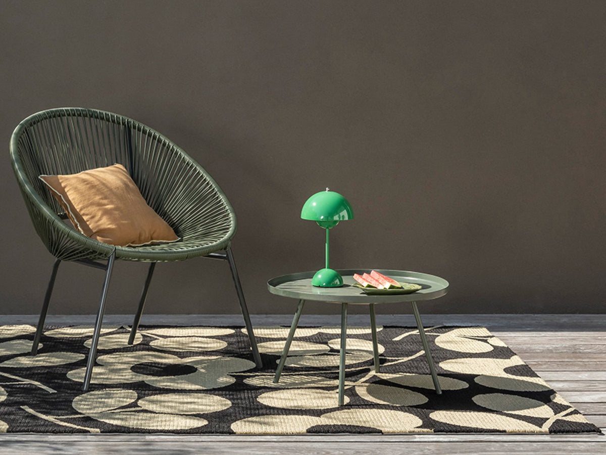 Orla Kiely Stem Sprig Monochrome outdoor rug on a terrace