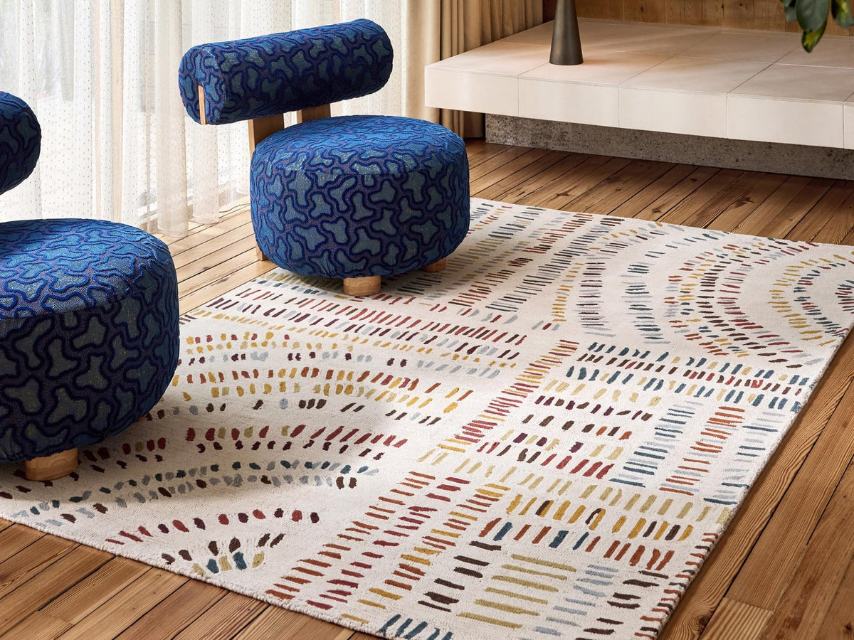 Harlequin Frescoes Amber 141701 rug styled in a room setting
