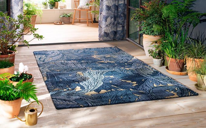 Morris & Co Acanthus Indigo outdoor rug on a terrace
