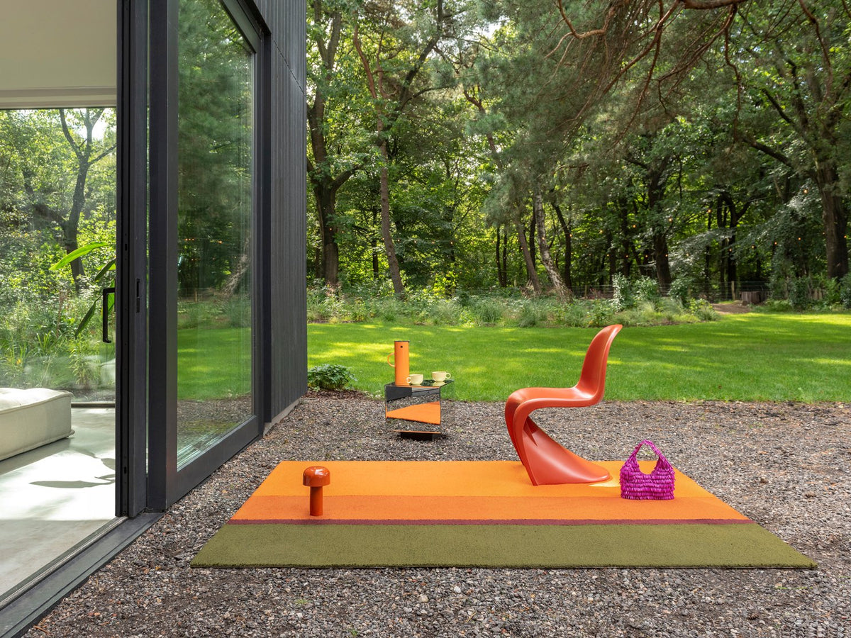 Habitat Festival Stripe Orange rug in a garden room