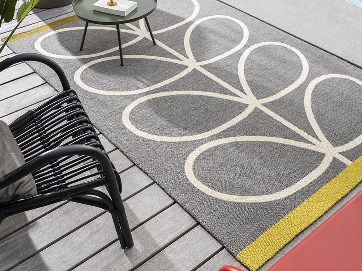 Orla Kiely Giant Linear Stem Slate outdoor rug on a terrace
