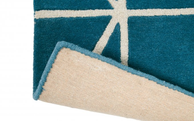 Scion Viso Denim rug corner turned to show the backing