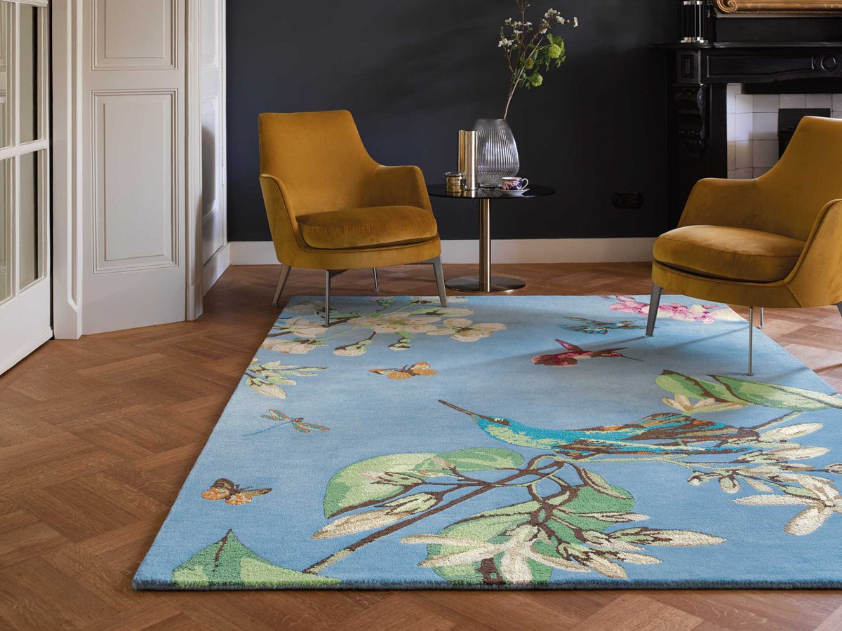 Wedgwood Hummingbird Blue 37808 rug styled in a room setting