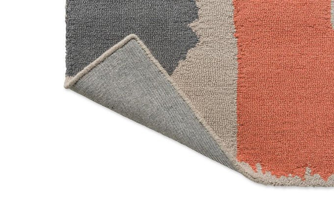 Scion Composition Amber rug corner turned to show the backing