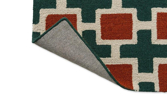 Scion Hatch Rust rug corner turned to show the backing
