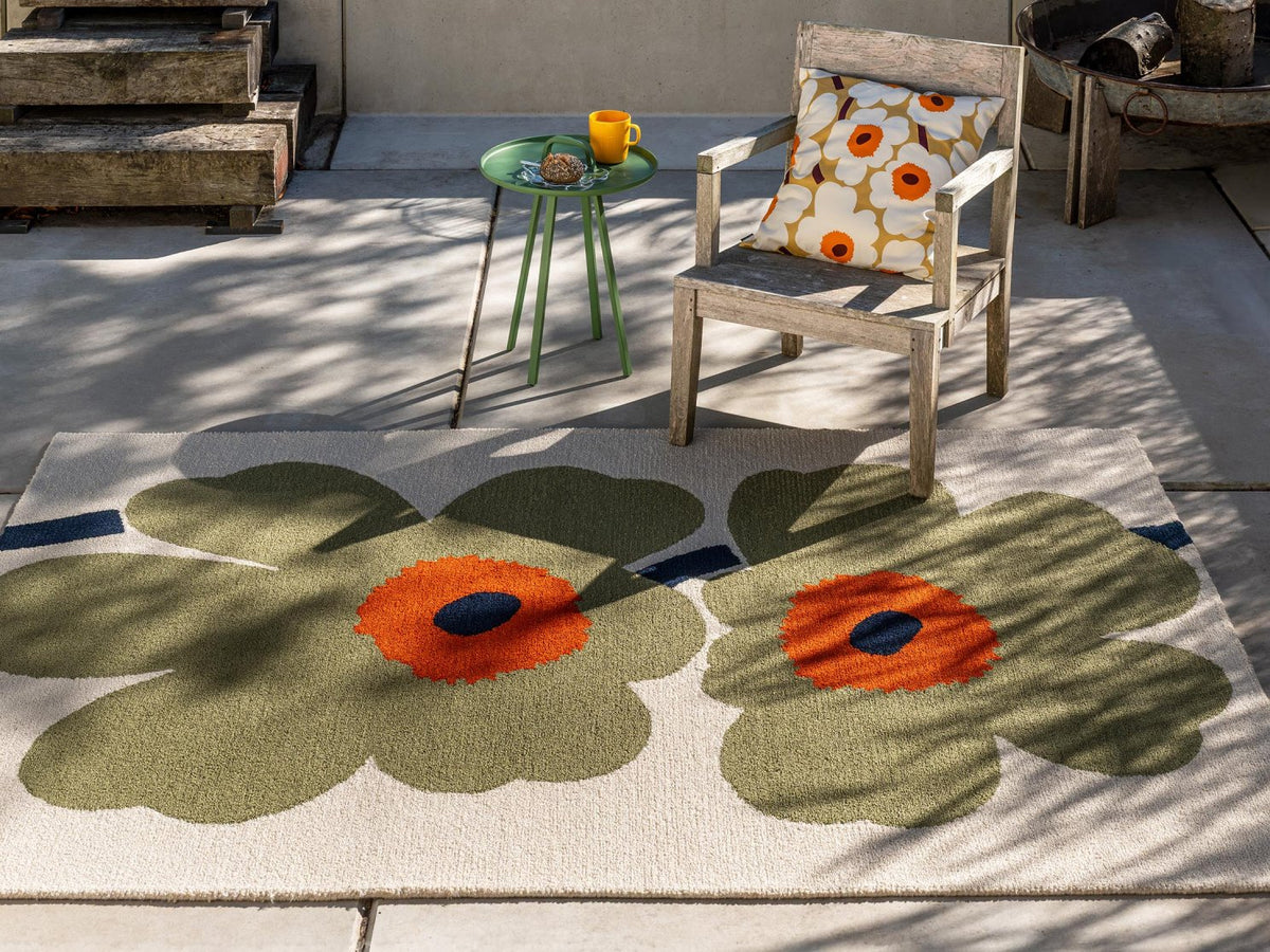 Marimekko Unikko Anniversary Dusty Green outdoor rug on a terrace