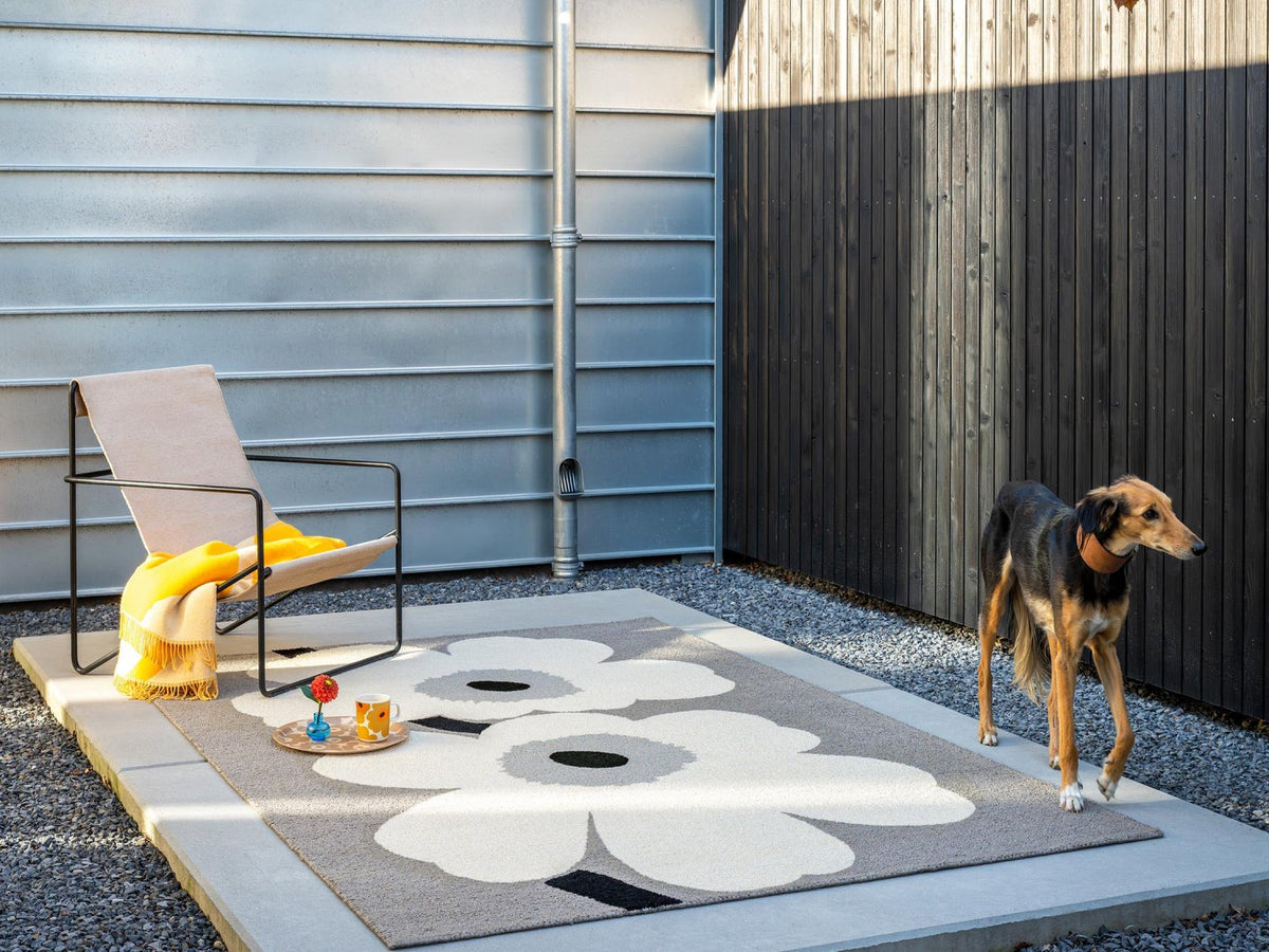 Marimekko Unikko Anniversary Grey outdoor rug on a terrace