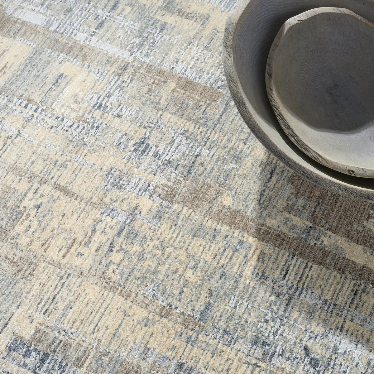 Calvin Klein Drift DRF04 Blue Beige rug styled in a room setting