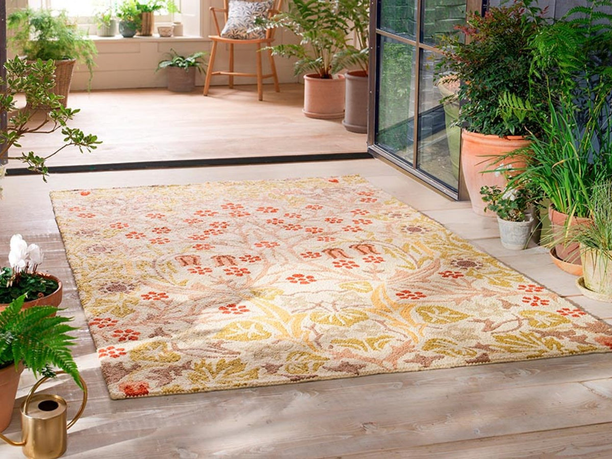 Morris & Co Blackthorn Wheat outdoor rug on a terrace