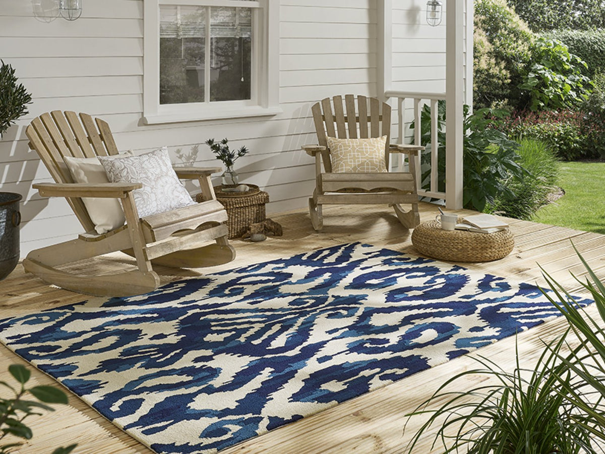 Sanderson Kasuri Indigo outdoor rug on a terrace