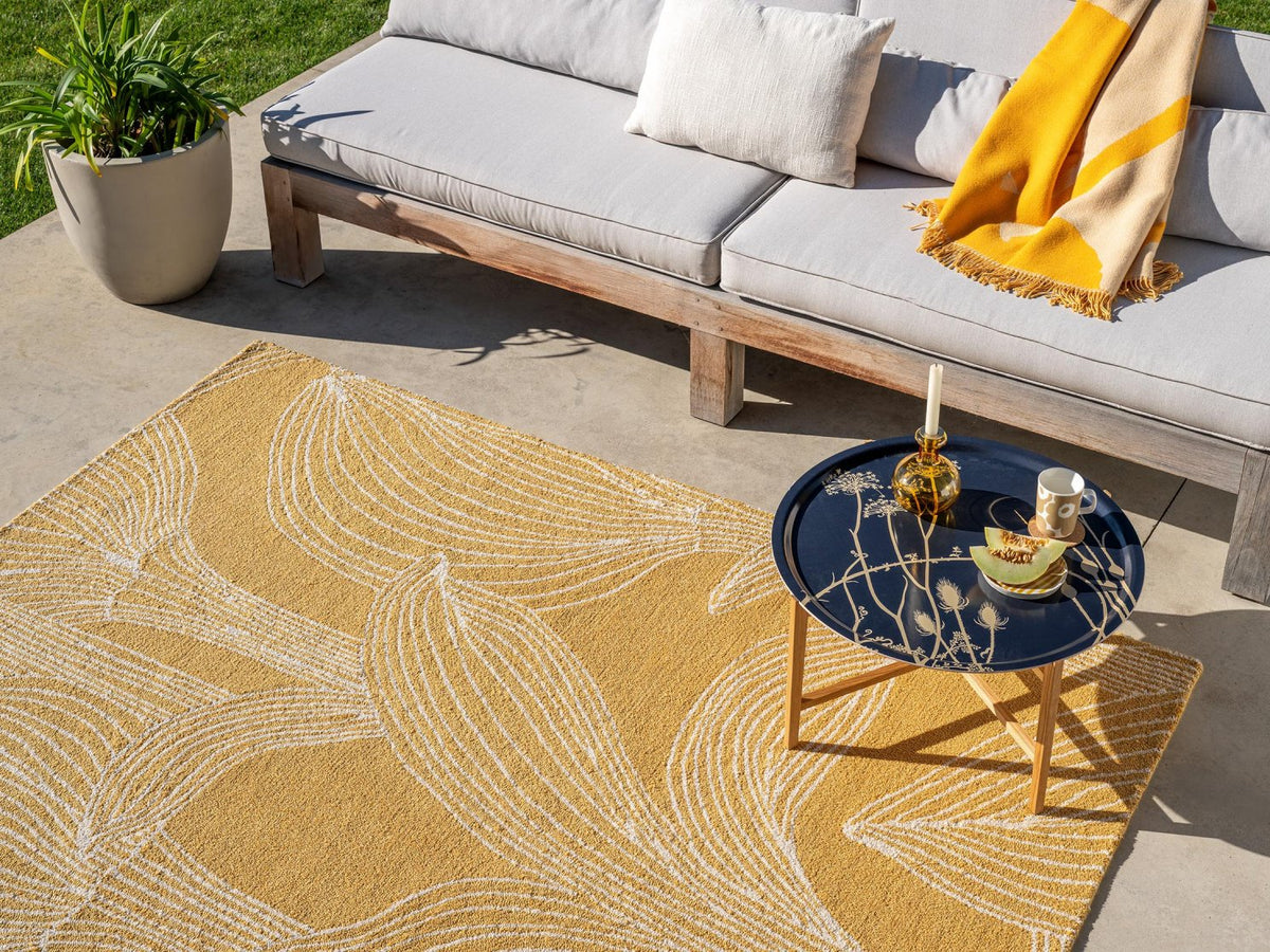 Marimekko Kukat Puhkeavat Straw outdoor rug on a terrace
