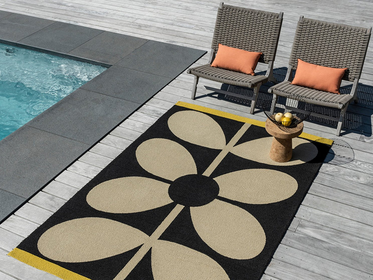 Orla Kiely Giant Sixties Stem Noir outdoor rug on a terrace