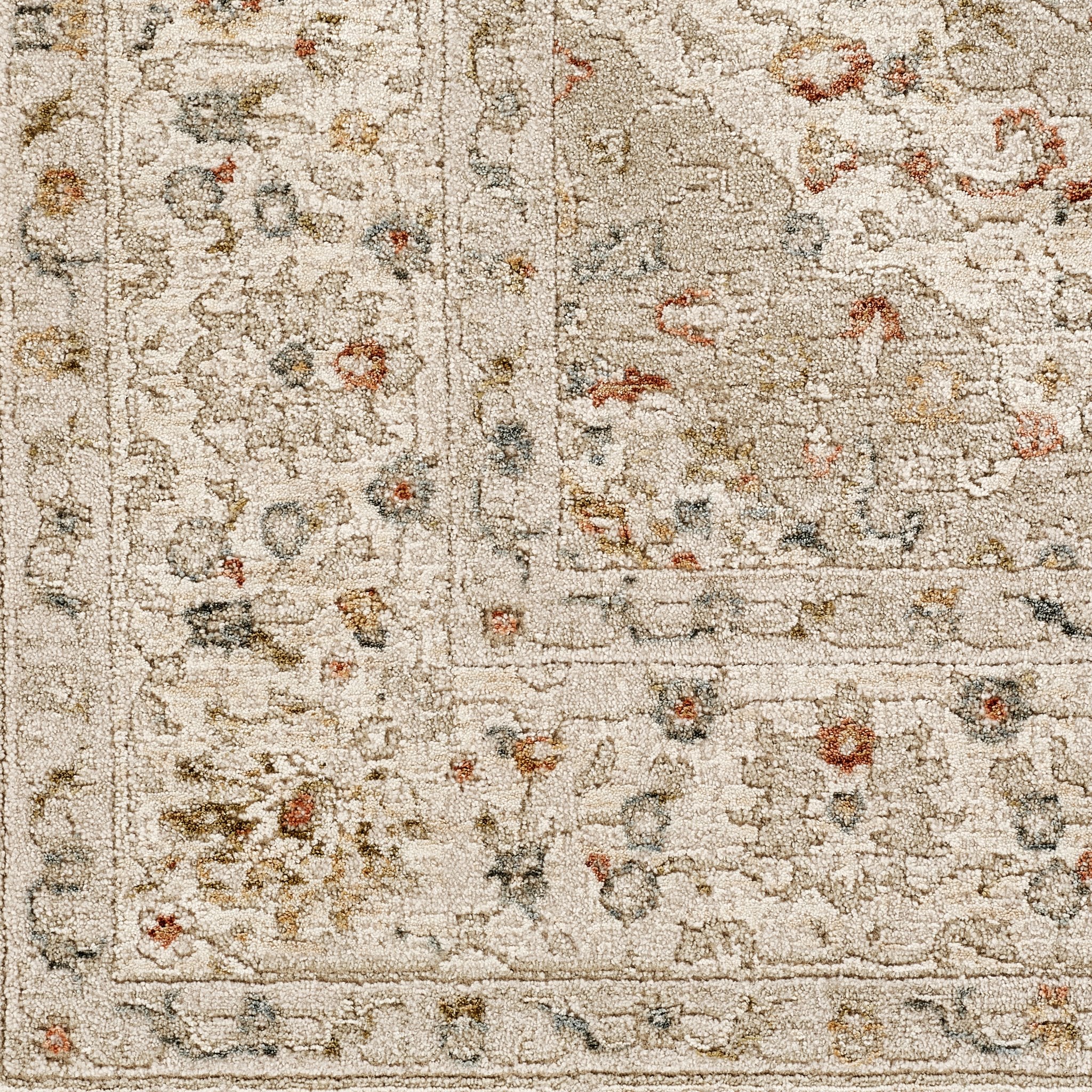 Comila Ivory rug close-up of floral border detail