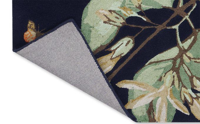 Wedgwood Hummingbird Navy 37818 rug corner turned to show the backing
