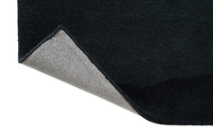 Harlequin Sedimentary Midnight 141005 rug corner turned to show the backing