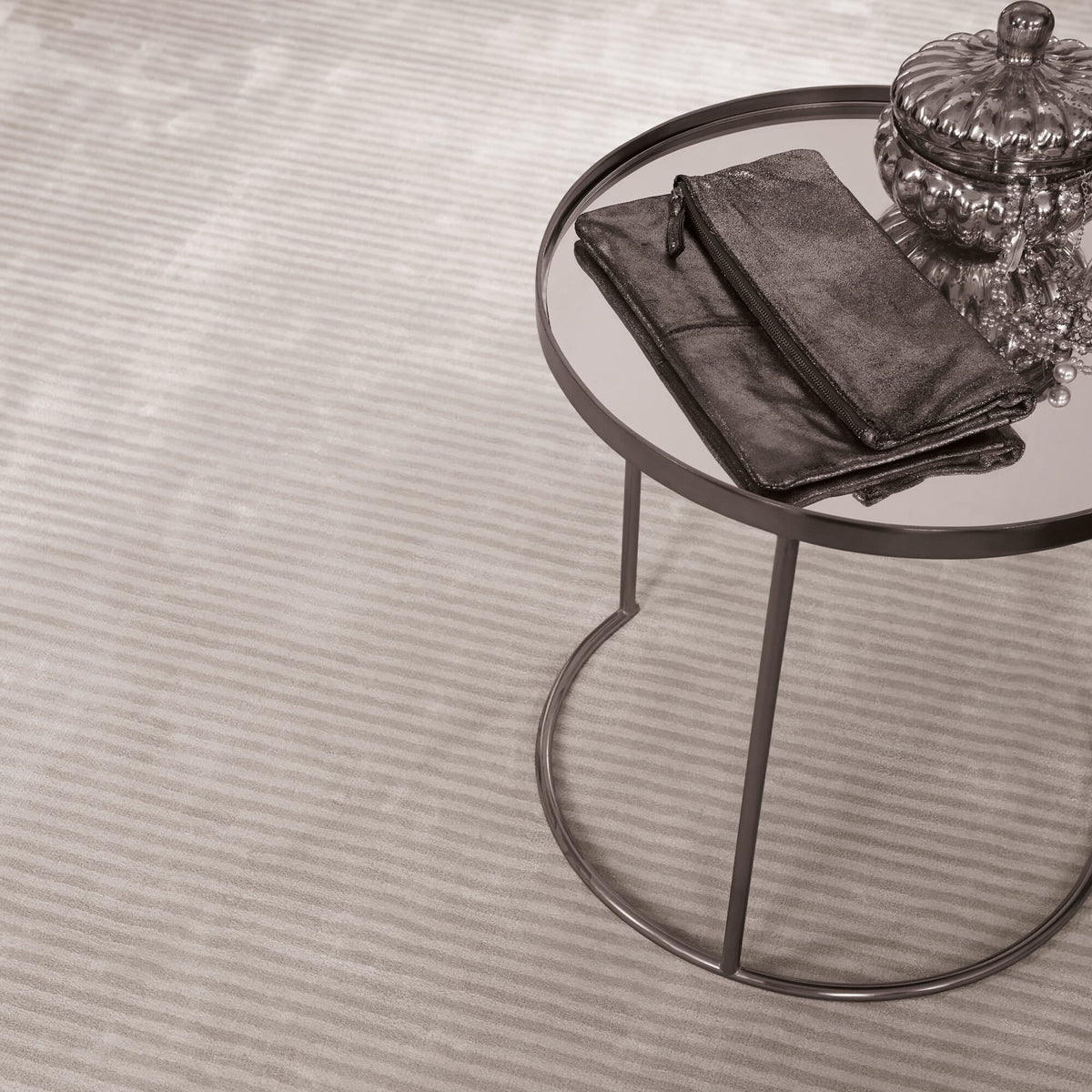 Katherine Carnaby Chrome Stripe Feather rug in a living room