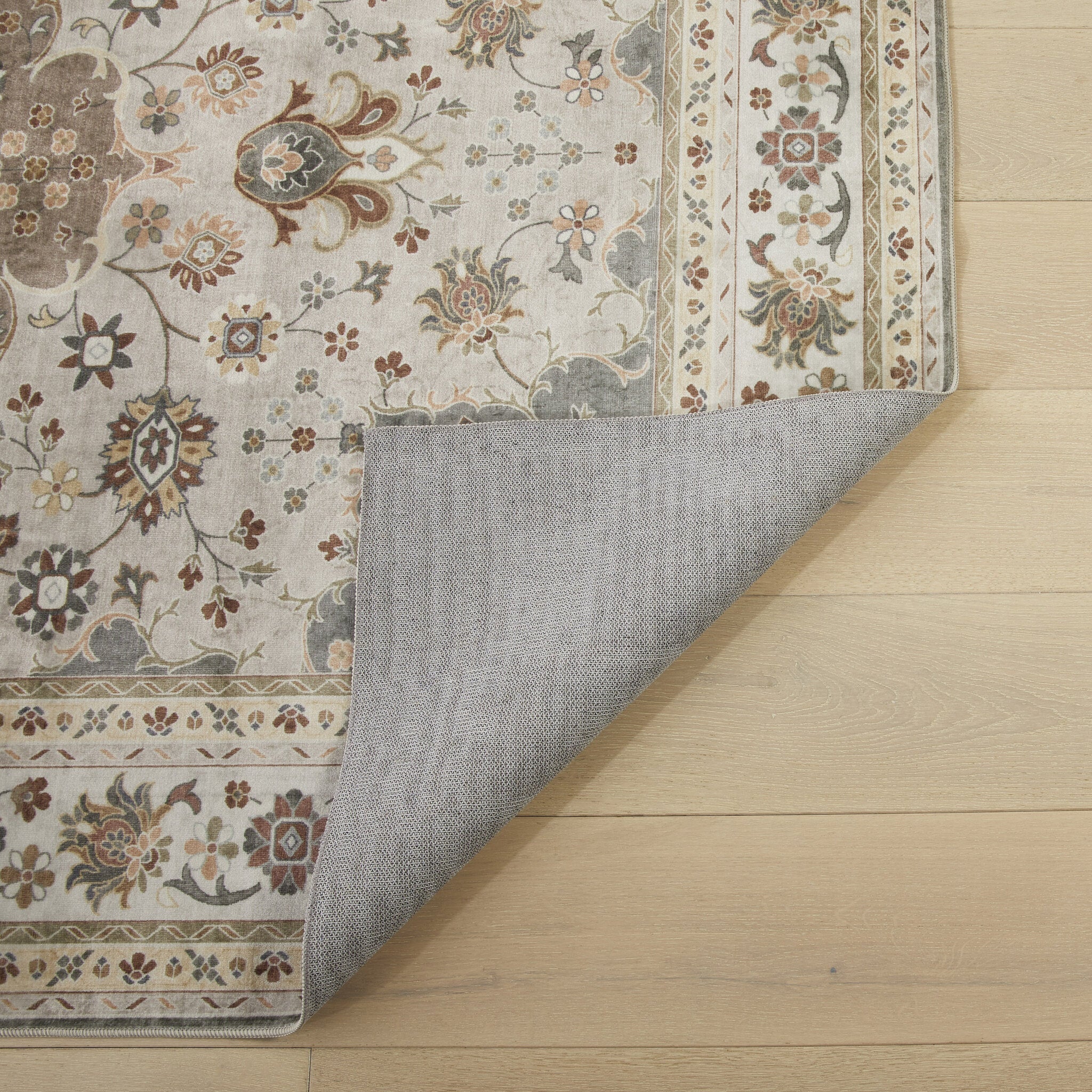 Liberty Lib 207 Mocha washable rug corner folded back to show the non-slip backing