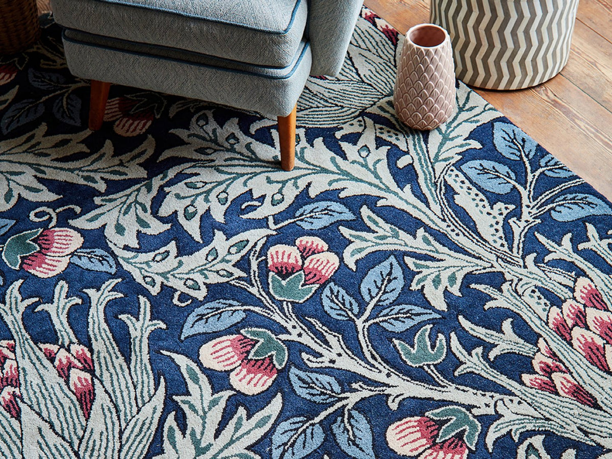 A Morris & Co Artichoke rug in a mineral colourway styled in a room