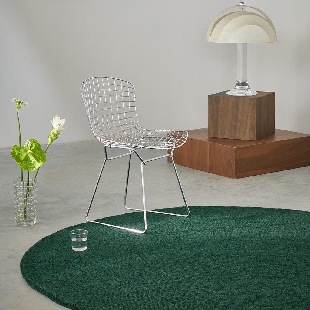 A round patterned rug styled in a living room setting