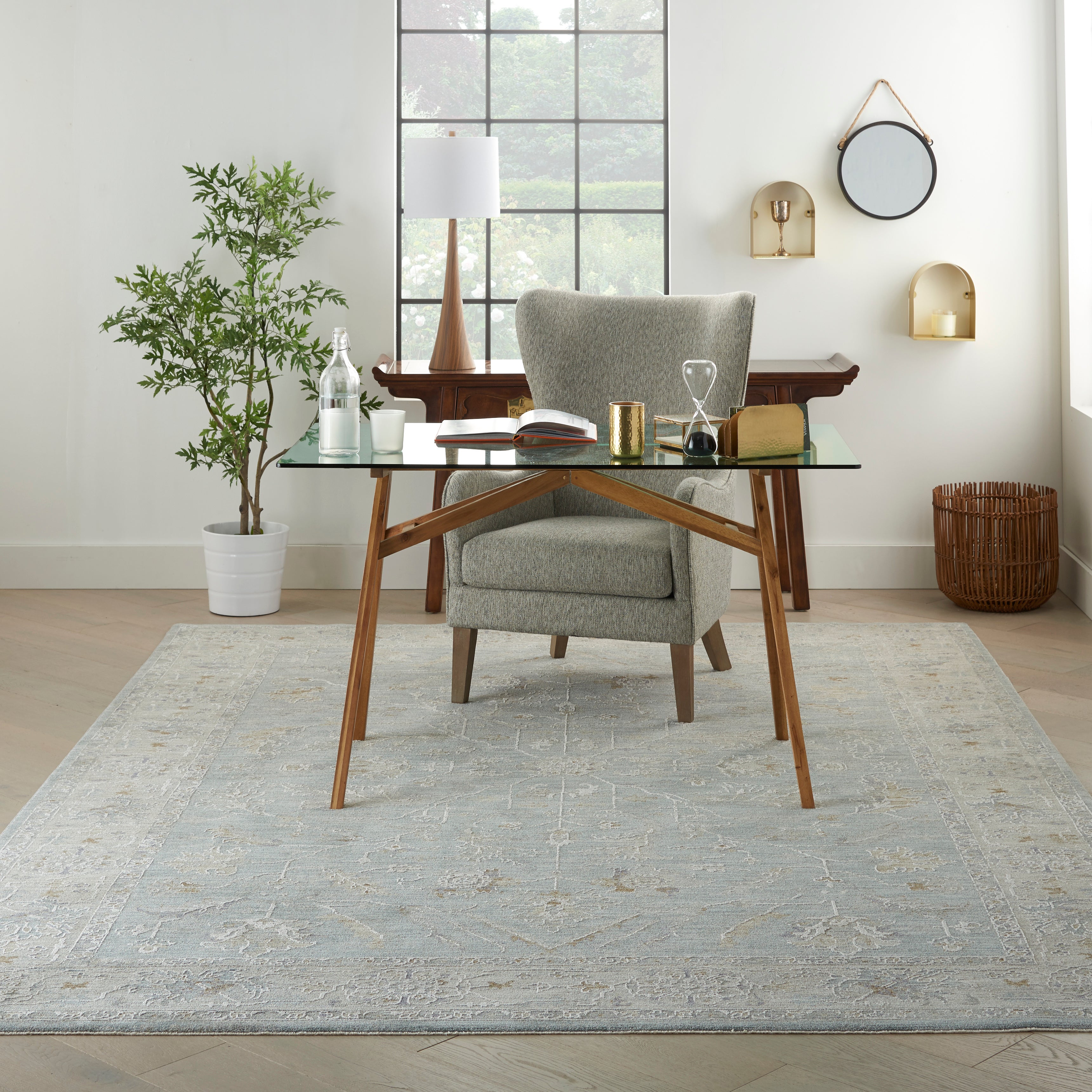 A blue patterned rug running the length of a hallway