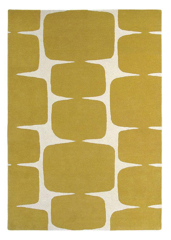 A honey-toned geometric designer rug suited to a hospitality interior