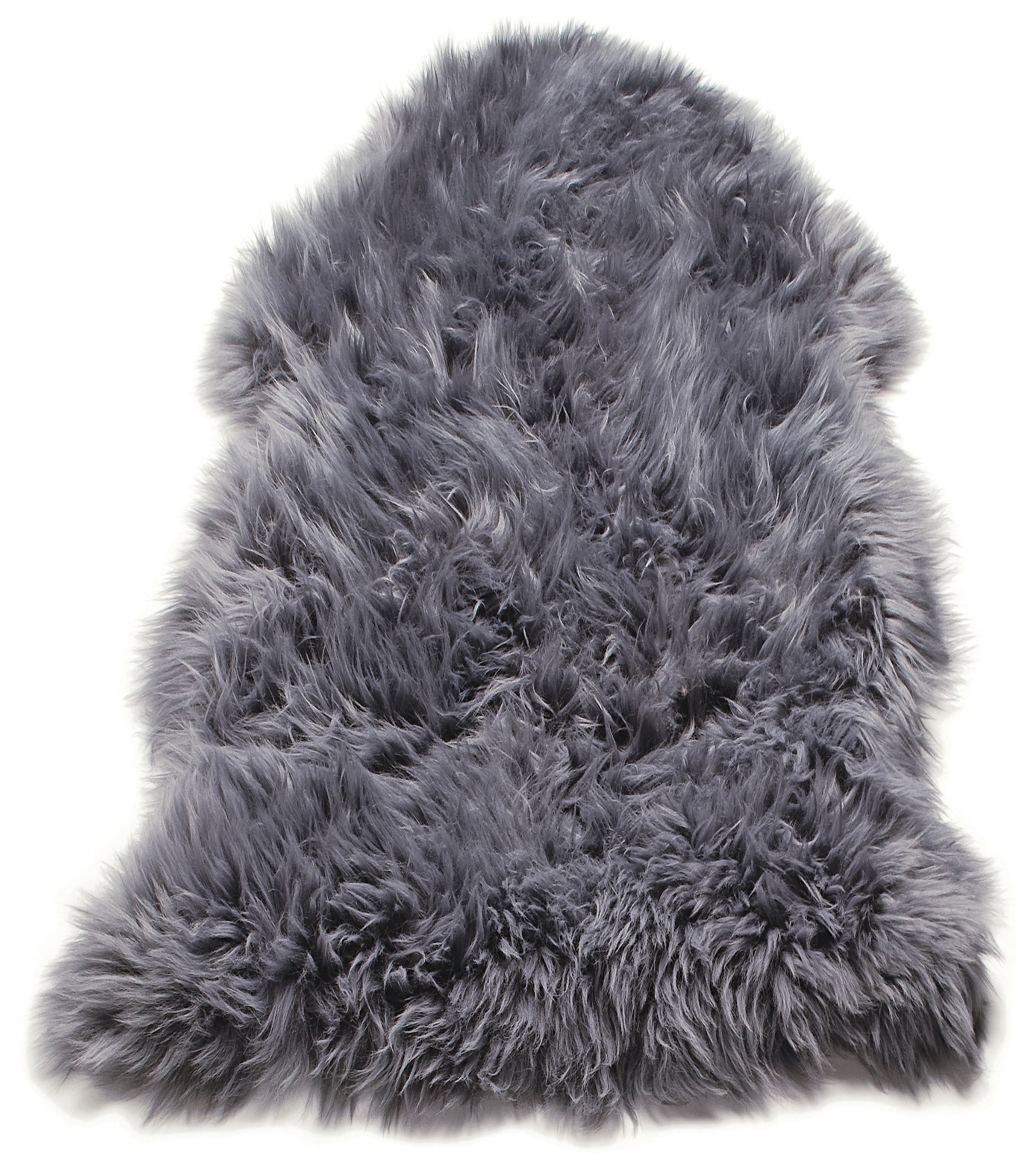 A grey sheepskin, often layered over a larger rug