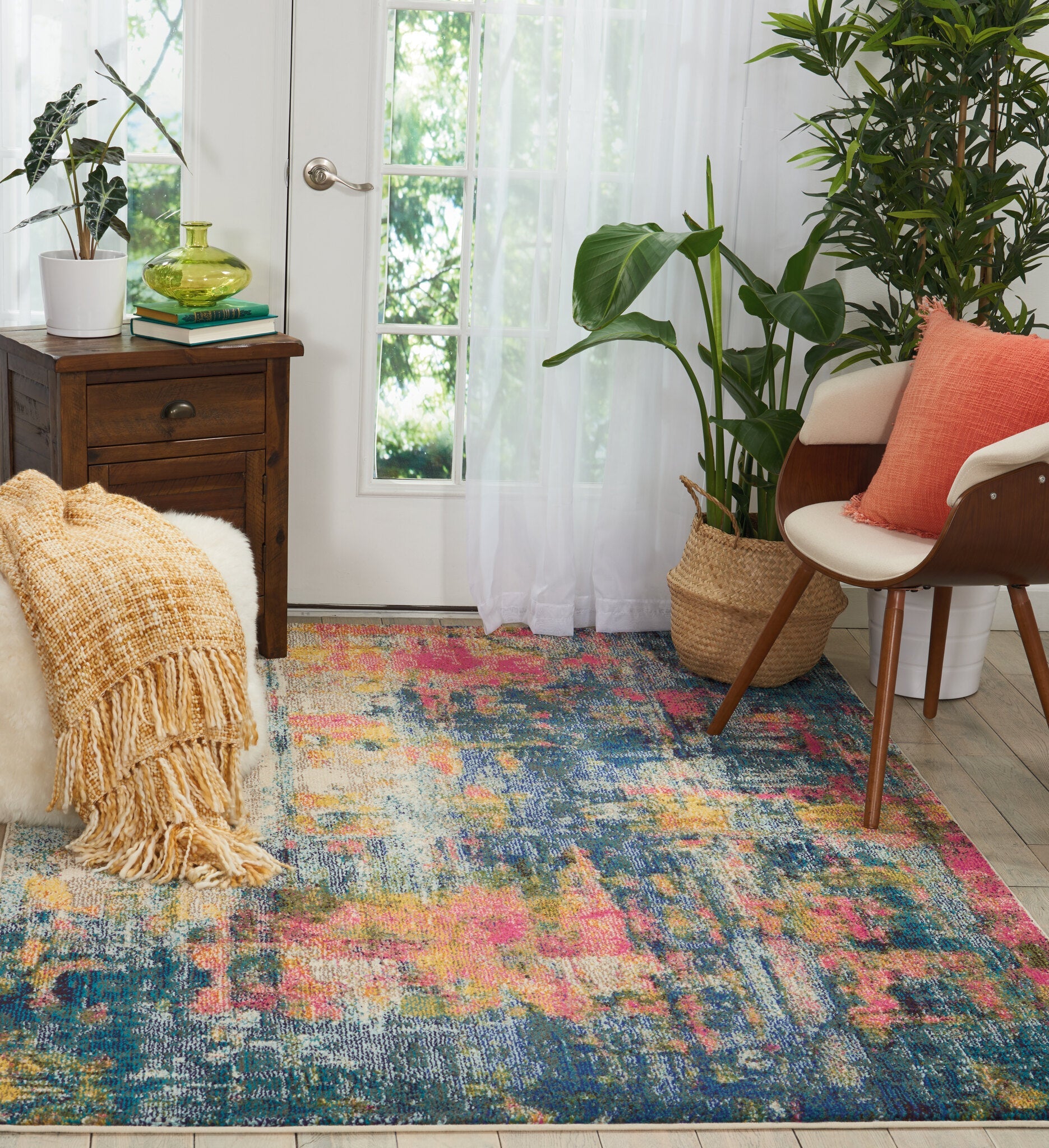A blue and yellow patterned rug showing how colour anchors a scheme
