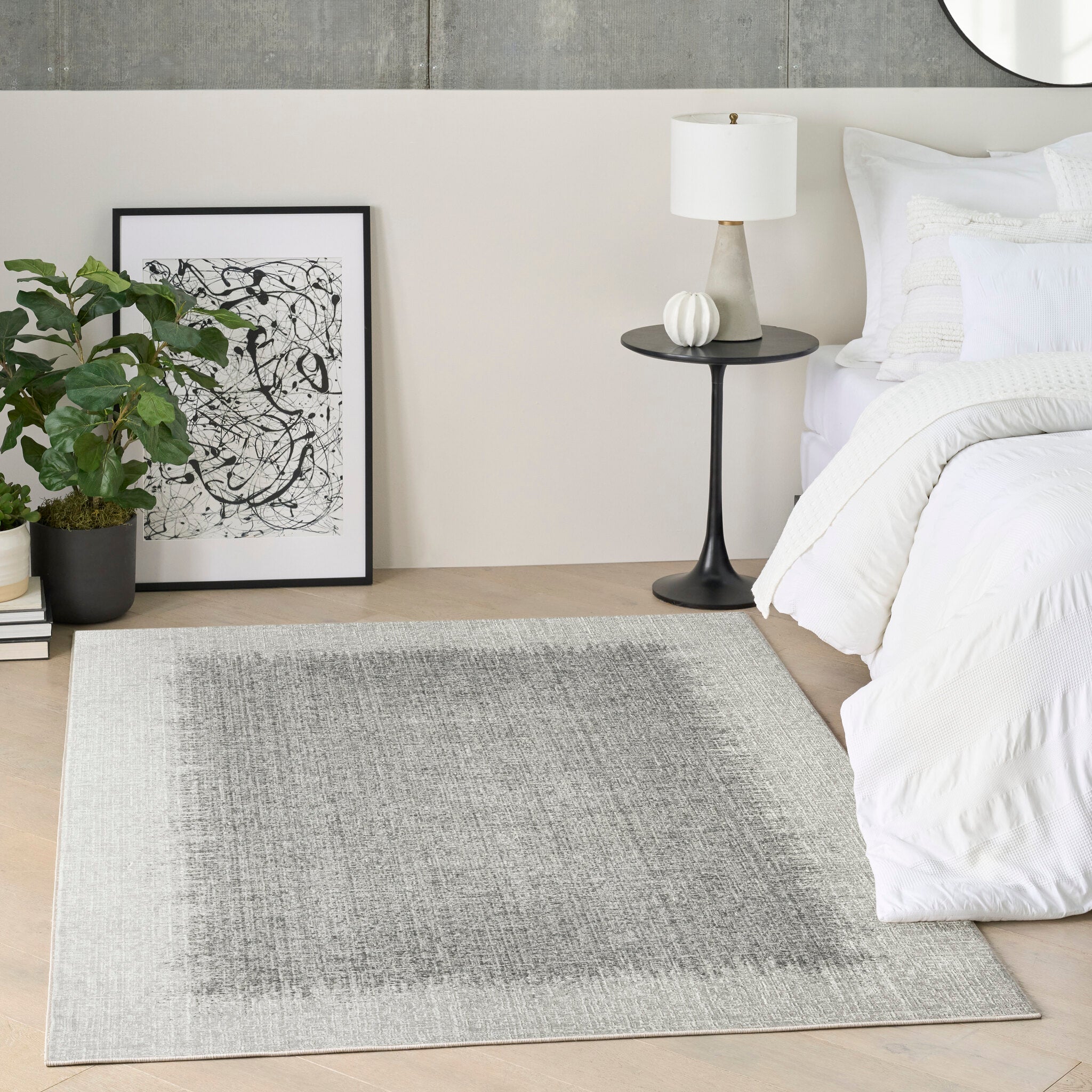 A light grey designer rug in a contemporary interior