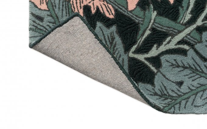 Morris & Co Honeysuckle & Tulip Teal rug corner turned to show the backing