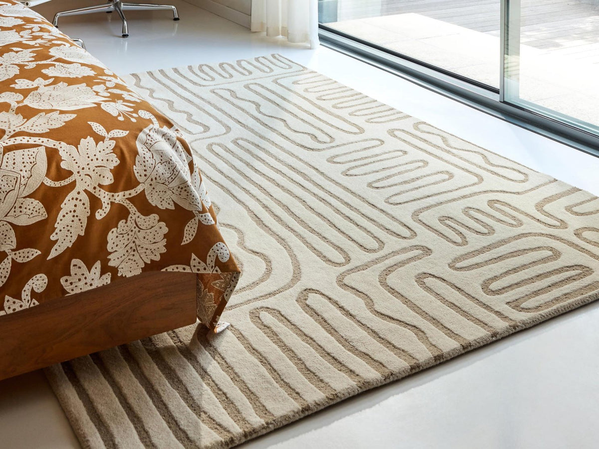 Harlequin Hollow Pebble 141101 rug styled in a room setting