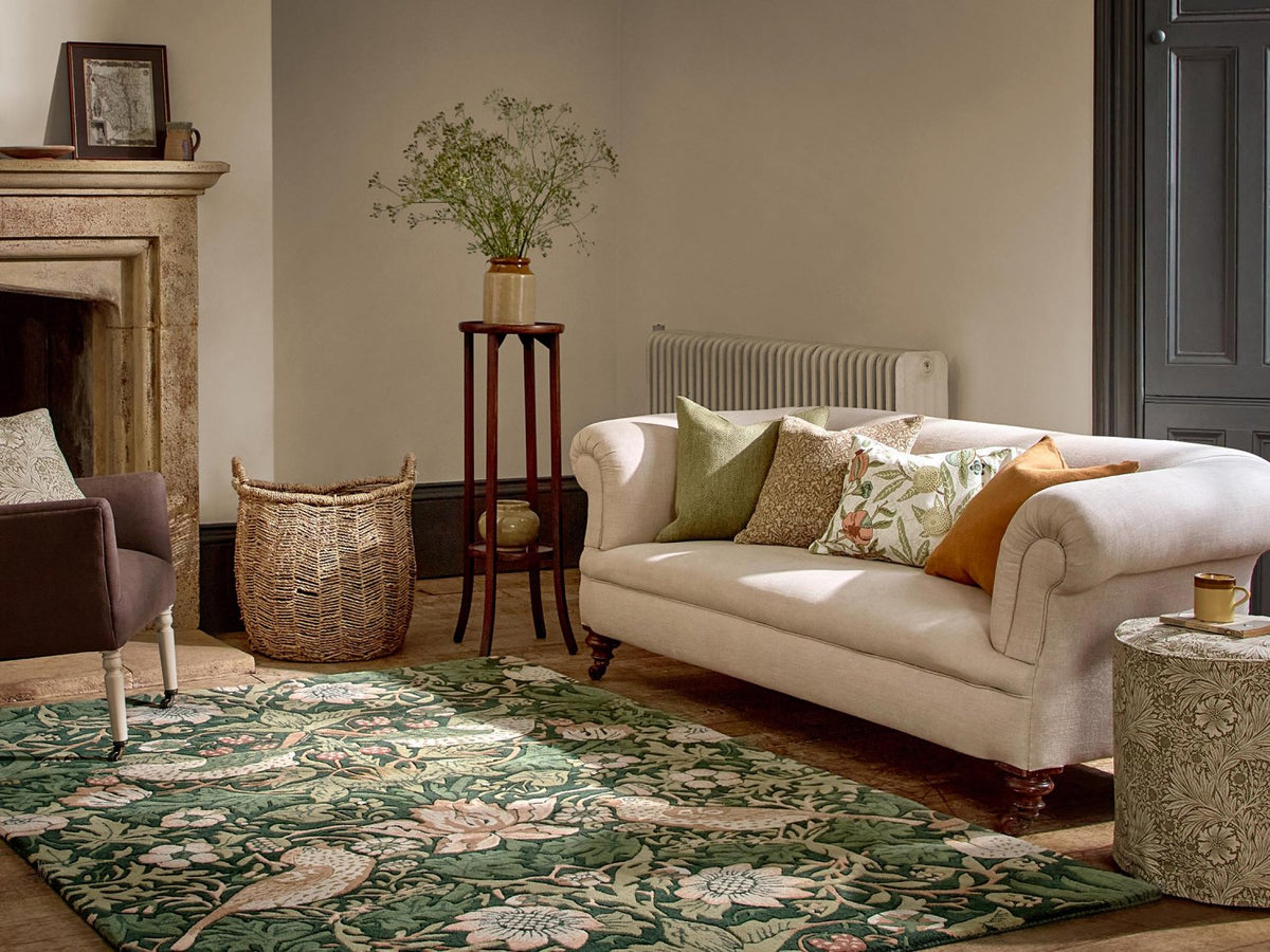 Morris & Co Strawberry Thief Forest rug styled in a room setting