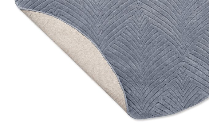 Wedgwood Folia 2.0 Cool Grey Round 38904 rug corner turned to show the backing