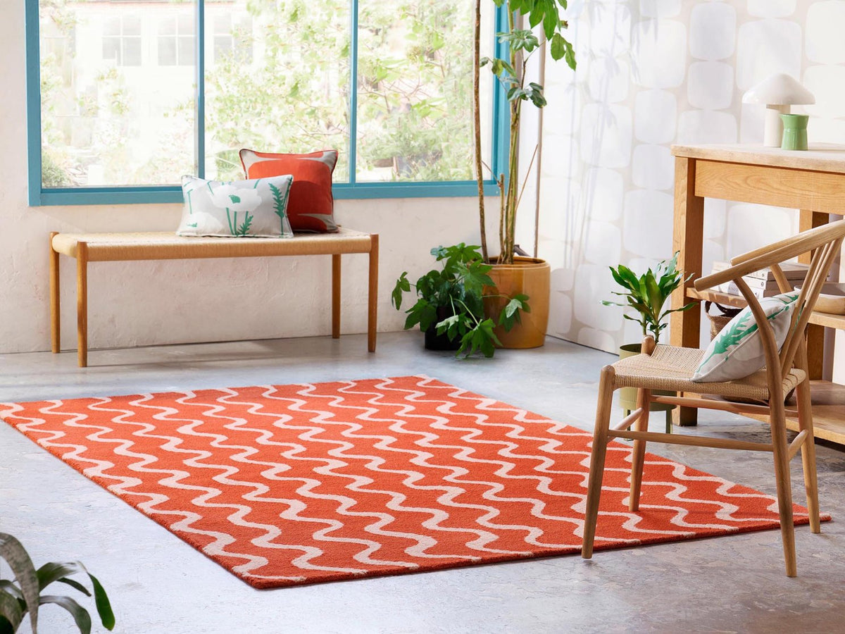 Scion Ribbon Coral rug styled in a room setting