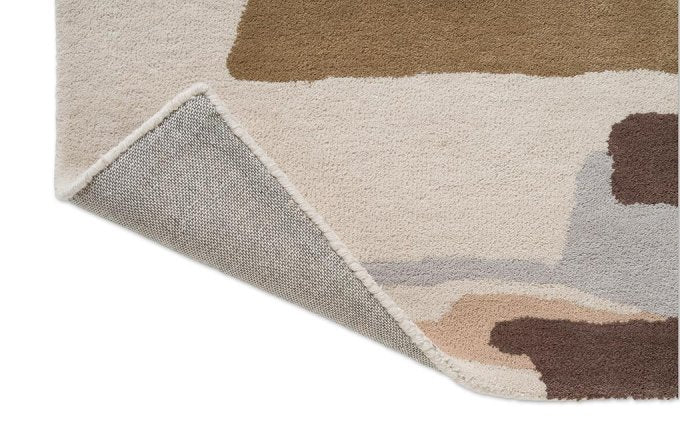 Harlequin Zeal Taupe 43001 rug corner turned to show the backing