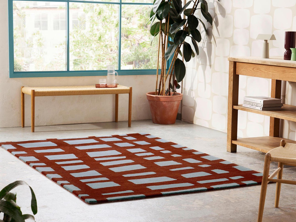 Scion Arlo Brick rug styled in a room setting