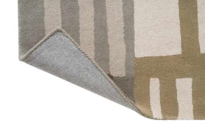 Harlequin Monolith Sandstone 144201 rug corner turned to show the backing
