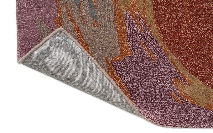 Harlequin Saltillo Rosewood 144600 rug corner turned to show the backing