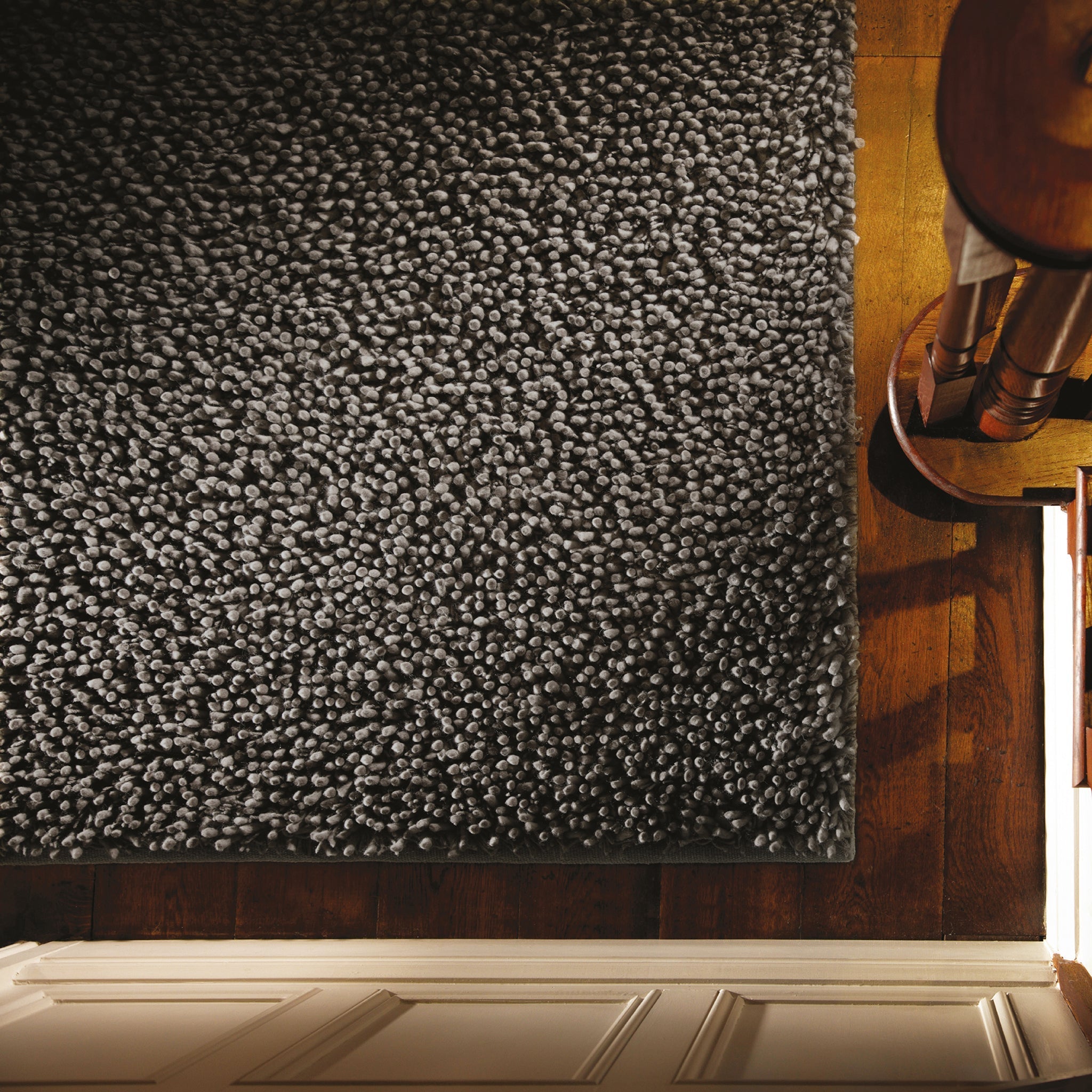 Maine Fossil hand-woven wool rug styled in a room setting