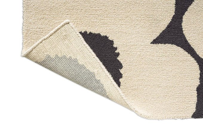 Marimekko Unikko Charcoal-White outdoor rug corner turned to show the backing