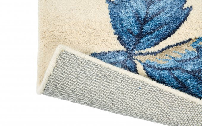 Wedgwood Wild Strawberry Cream 38108 rug corner turned to show the backing