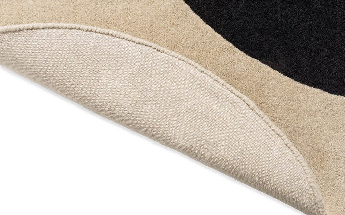 Orla Kiely Flower Spot Ecru/Black Round 158409 rug turned to show the backing