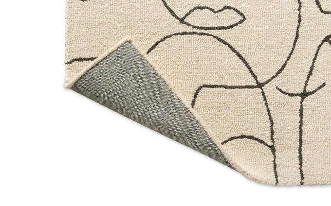 Scion Epsilon Charcoal rug corner turned to show the backing