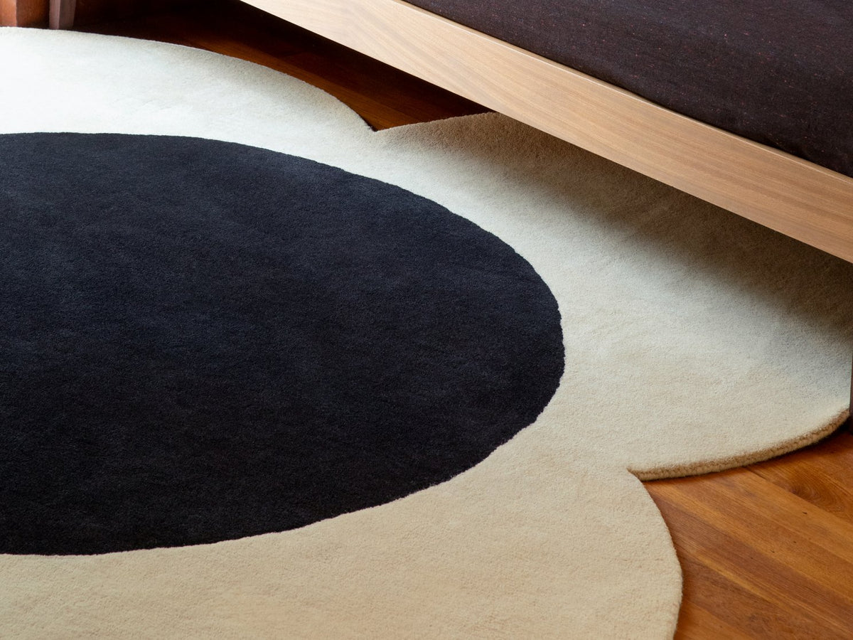 Orla Kiely Flower Spot Ecru/Black Round 158409 rug styled in a room setting