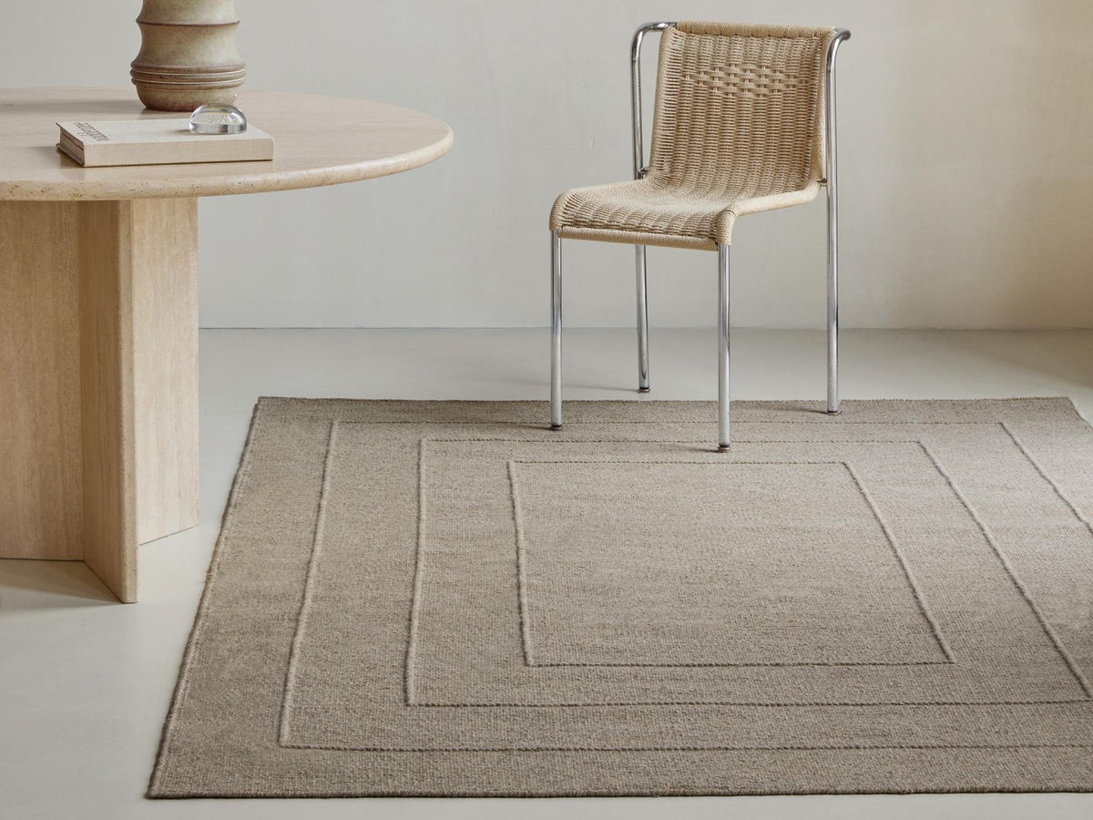 Senso Border Soft Taupe rug in a room setting